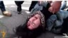 Armenia - Opposition protester Ruzanna Yegnukian is injured during a scuffle with riot police, Yerevan, 24March2016.