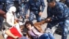 Полицейские задерживают участниц акции голодовки в Астане. 27 мая 2013 года. Иллюстративное фото.