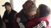 Пастор Бахтжан Кашкумбаев (в центре) у входа в СИЗО Астаны. 8 октября 2013 года.