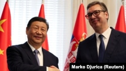 Chinese President Xi Jinping shakes hands with Serbian President Aleksandar Vucic at the Palace of Serbia during a meeting as part of the Chinese president's two-day state visit in Belgrade, Serbia, May 8, 2024.