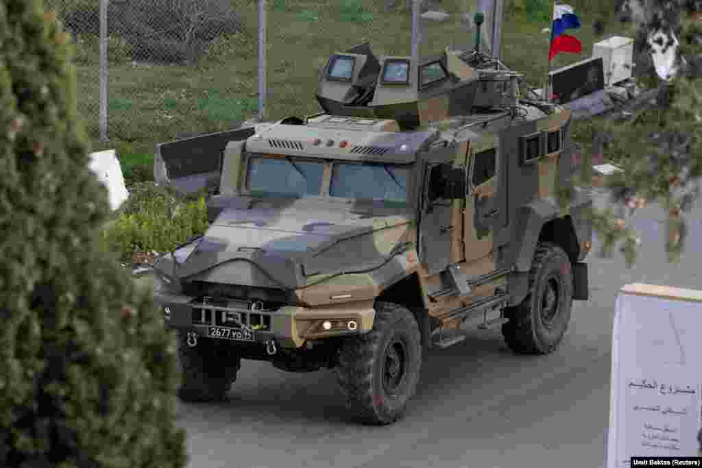 A Russian armored vehicle approaches the Hmeimim base. "It's interesting to be there without any control, any pressure," Bektas says. The photographer worked by first speaking to the rebel fighters around the base to alert them to his presence, then he says, "you find a relatively high building, stand there for four hours and take pictures. Something that was impossible is now happening."
